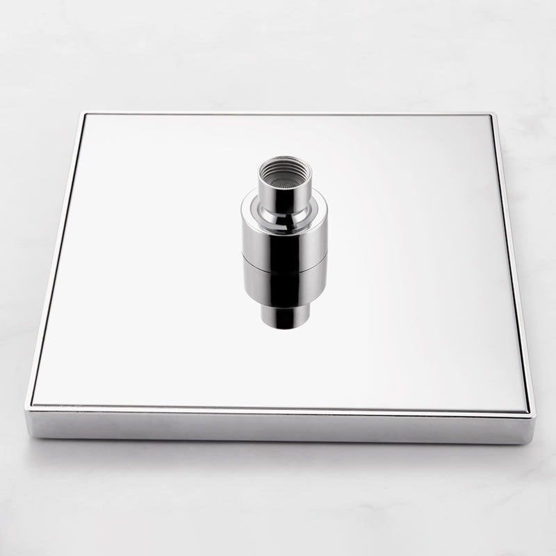 Chrome shower head on a square base against a white background